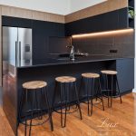 A photo of a kitchen island with 4 chairs