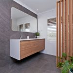 A photo of a bathroom area, with dual sinks.