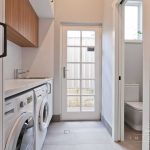 A photo of a laundry area in Daglish, with a toilet to the side.