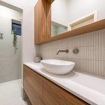 A photo of a bathroom area, with a toilet and sink.