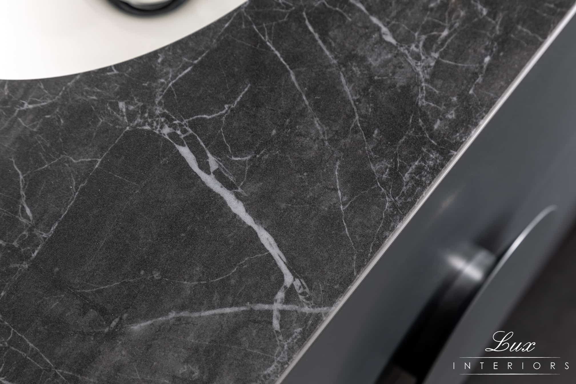 A photo of a black marble bench top.