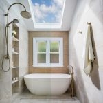 A photo of a skylight above a bath and shower.