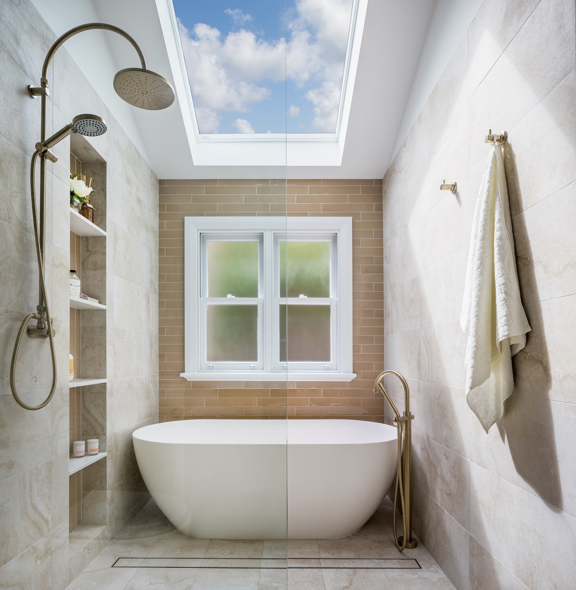 A photo of a skylight above a bath and shower.