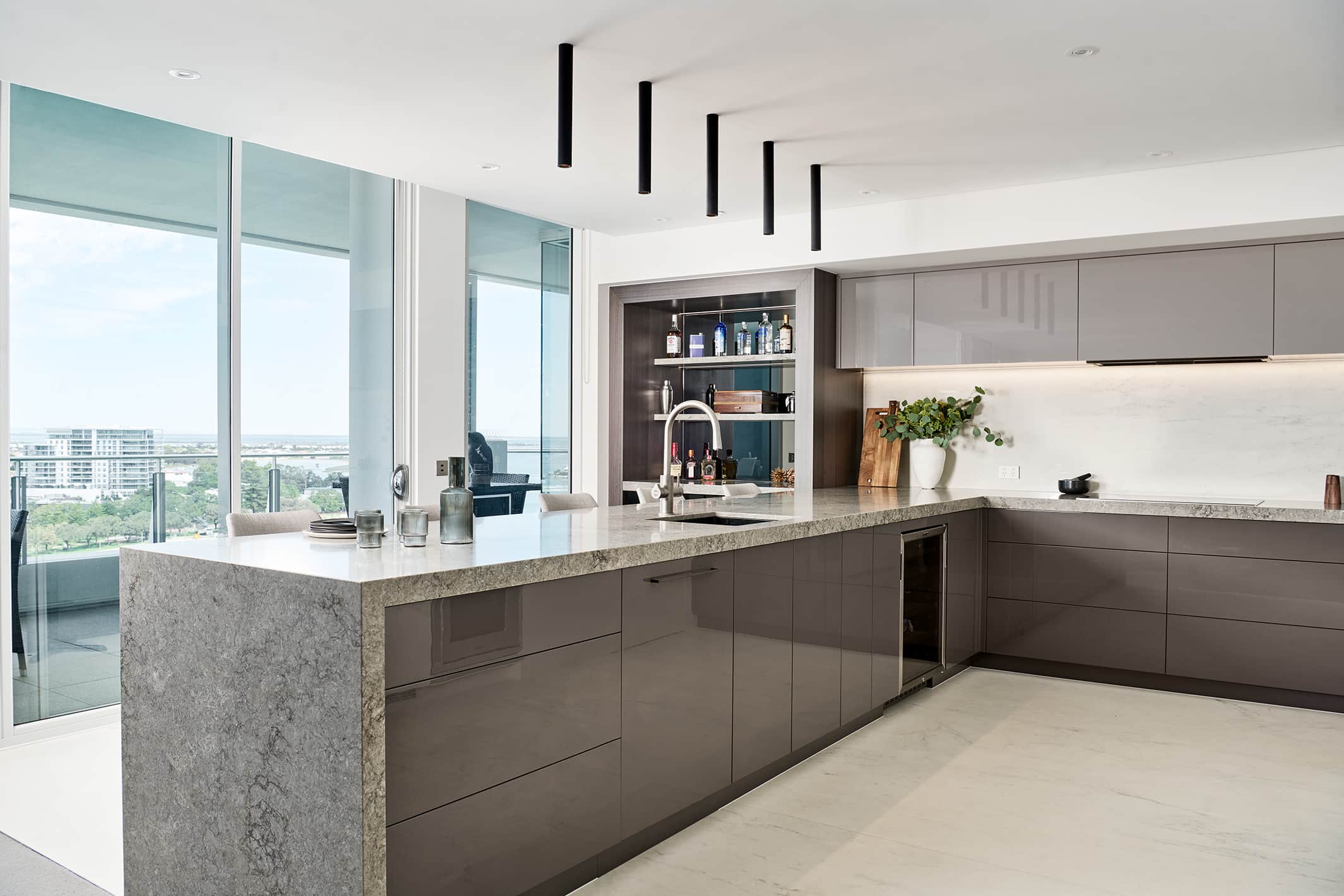 A photo of a kitchen area, with a view of Mandurah in the background.