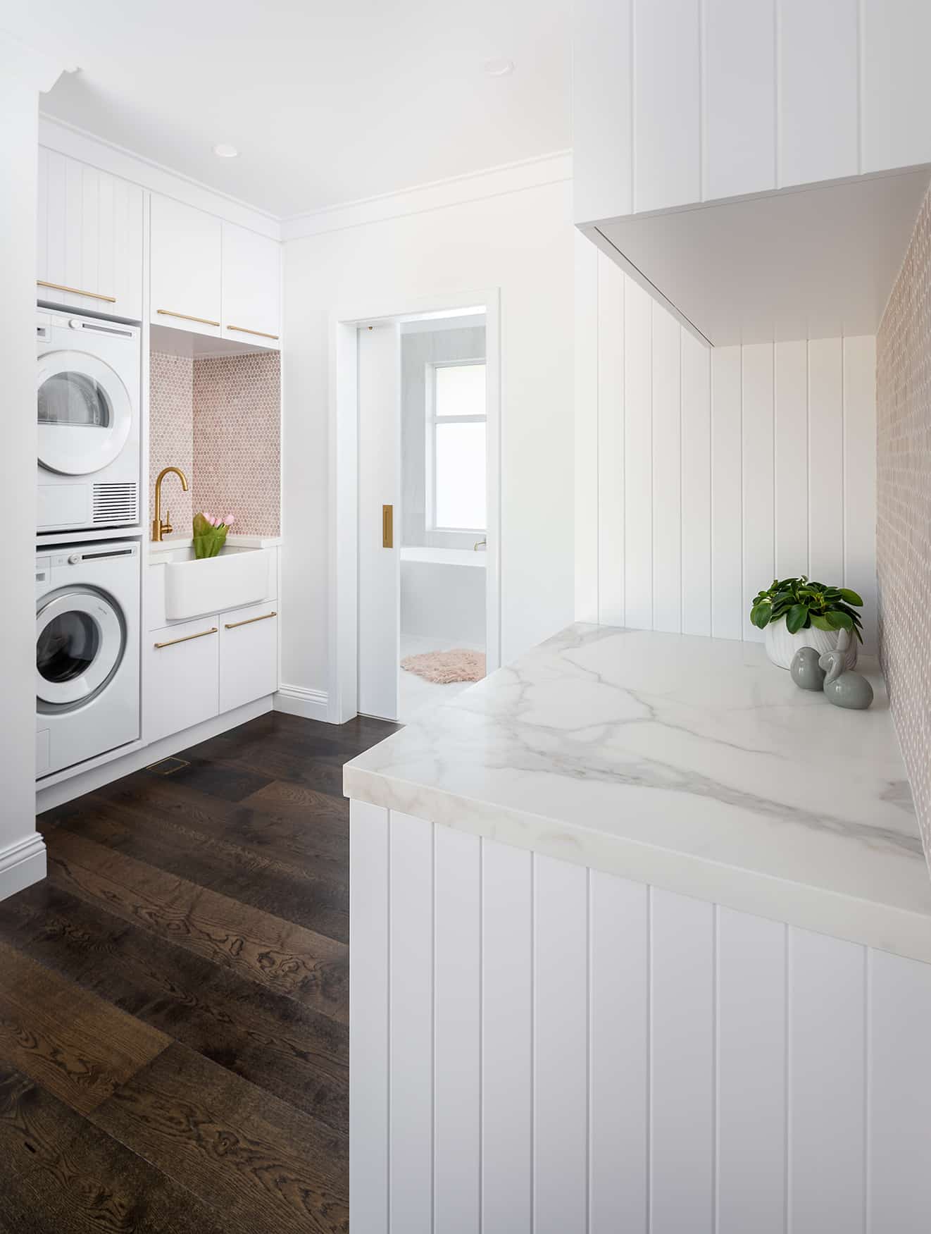 A photo of a walk-through laundry space