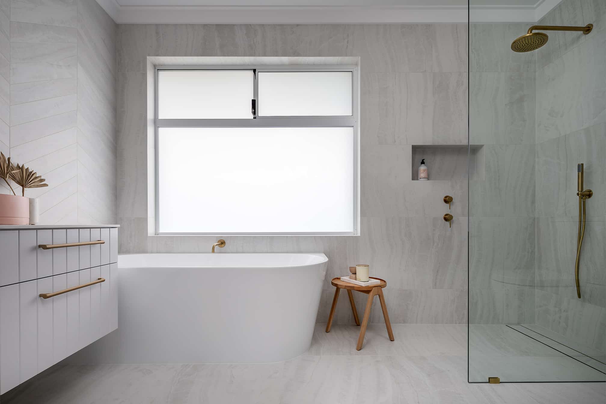 A photo of a bathroom area, with a large tub and shower.