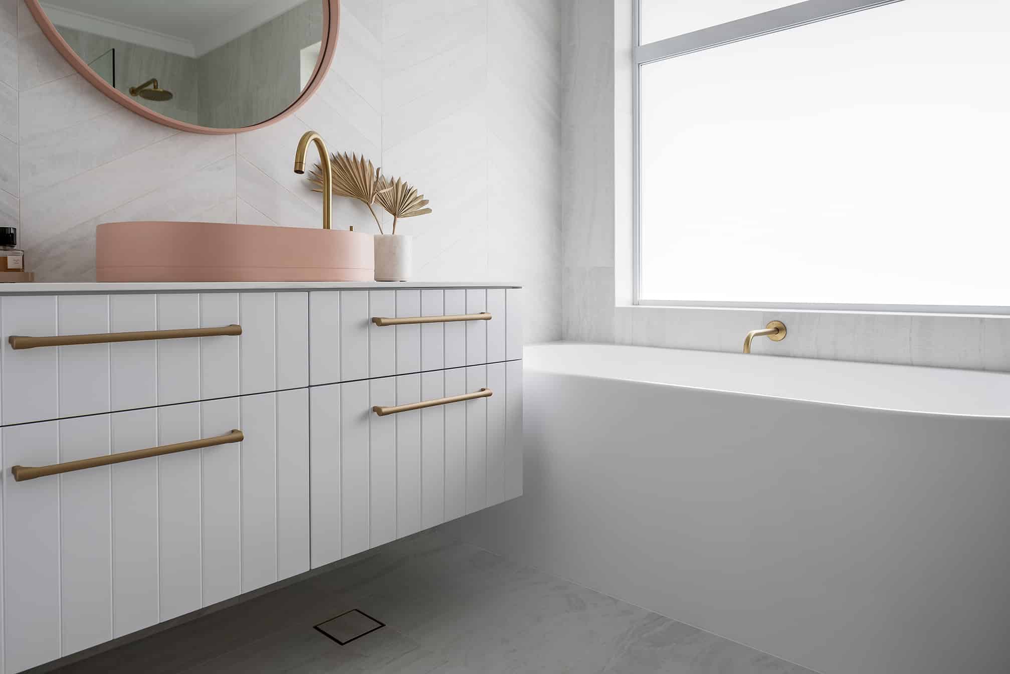 A photo of a sink with cabinets and a bath tub.