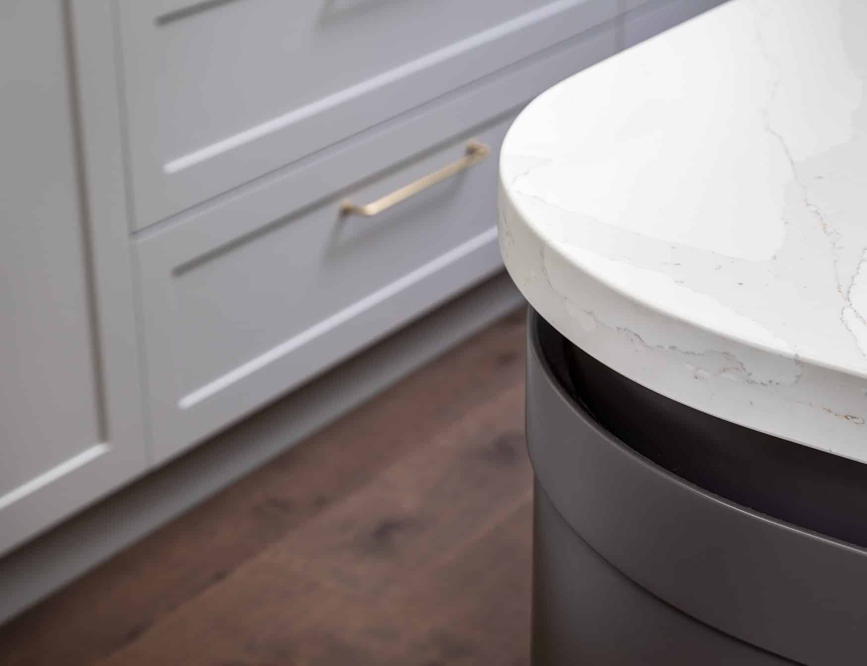 A photo of the corner of a kitchen island bench.