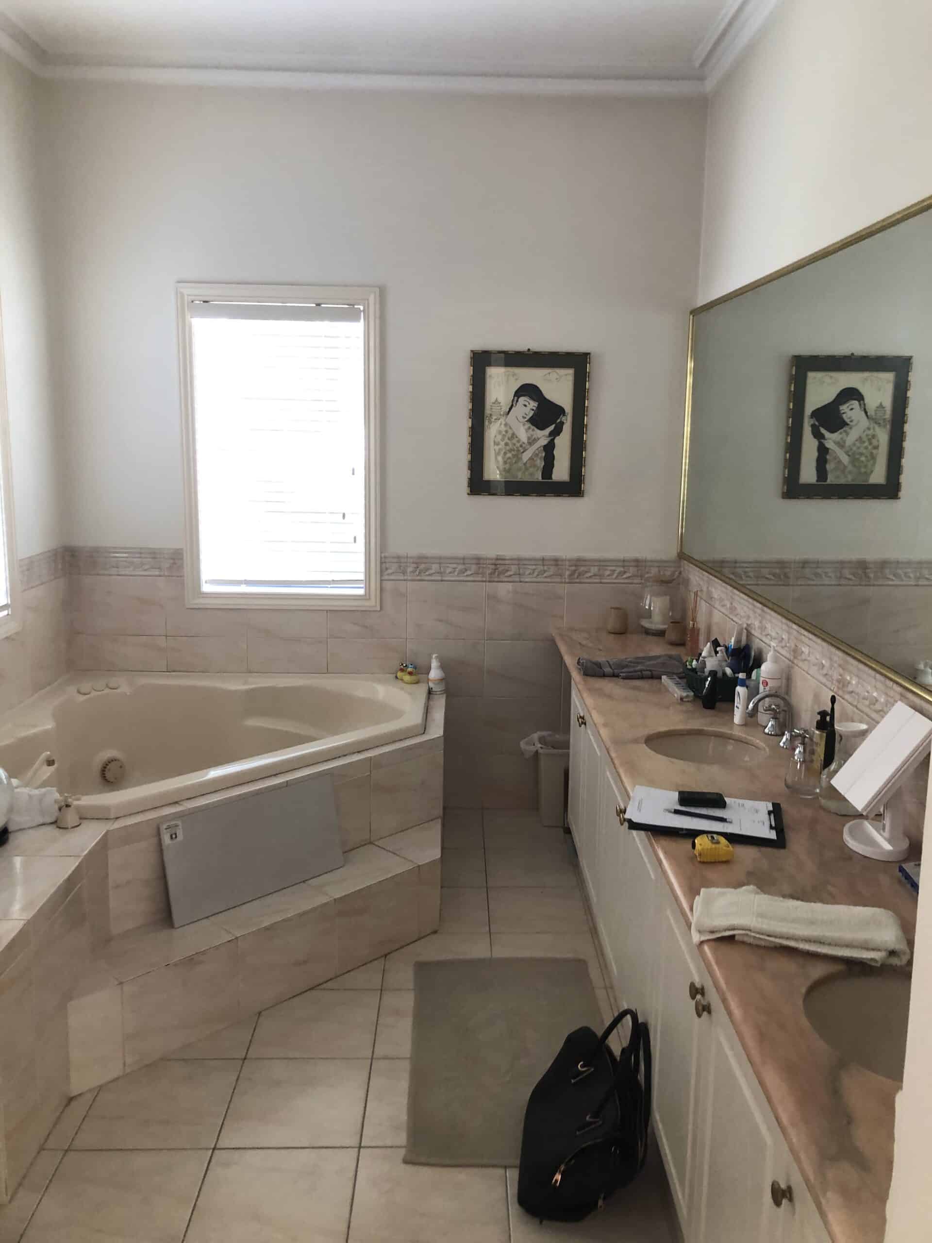 A photo of the bathroom before being renovated by Lux Interiors.