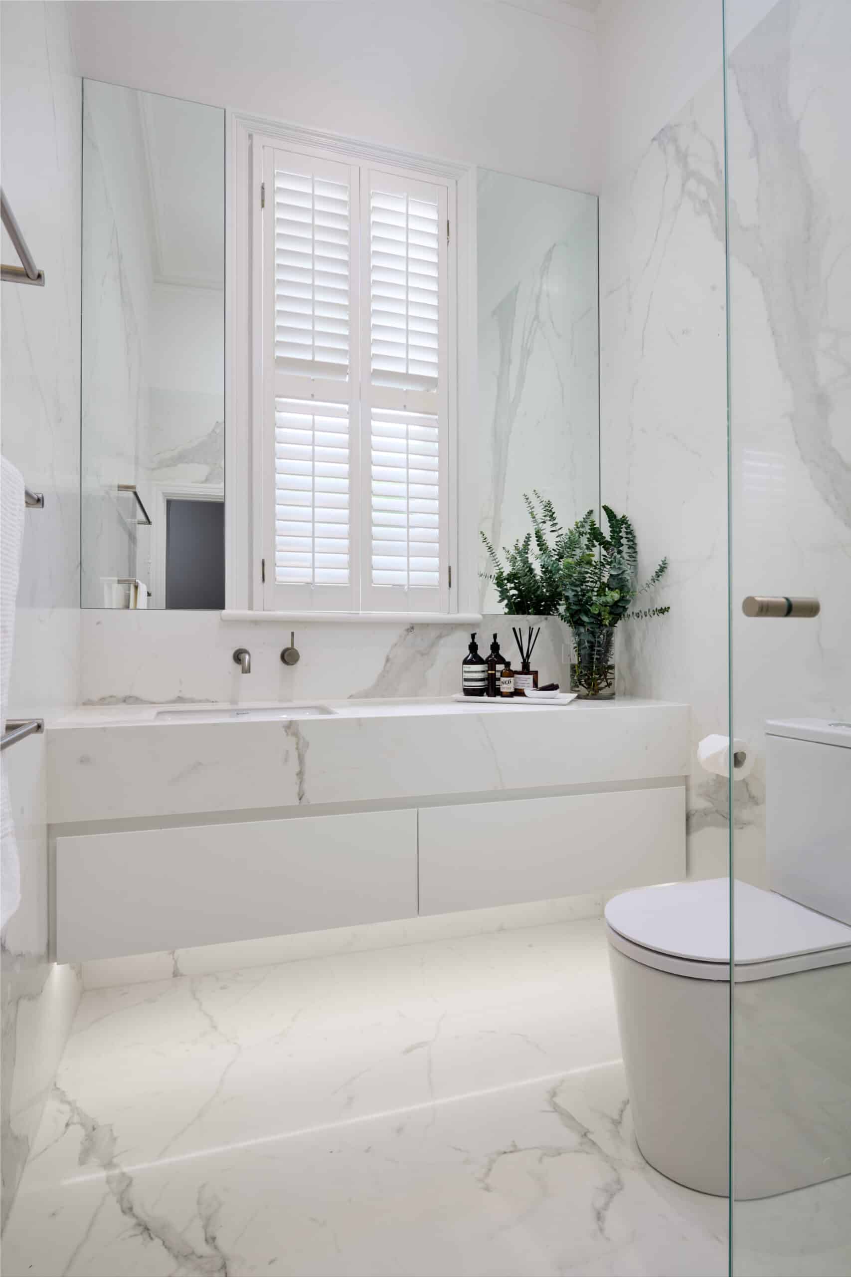 A photo of a bathroom area, with a toilet and sink.