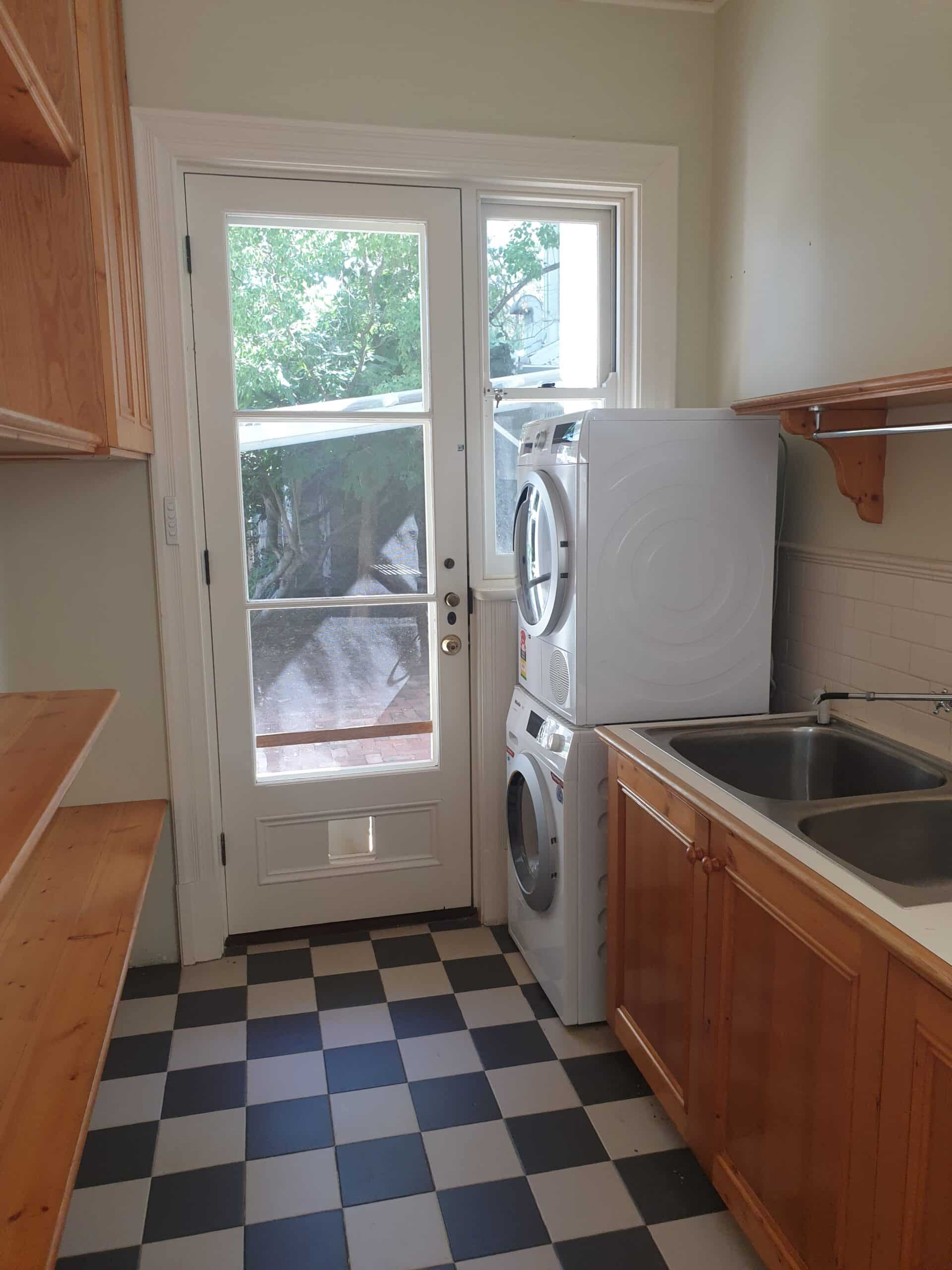 A photo of a laundry area, with washing machine and dryer.