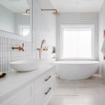 A photo of a bathroom, with a shower, sink and bathtub.