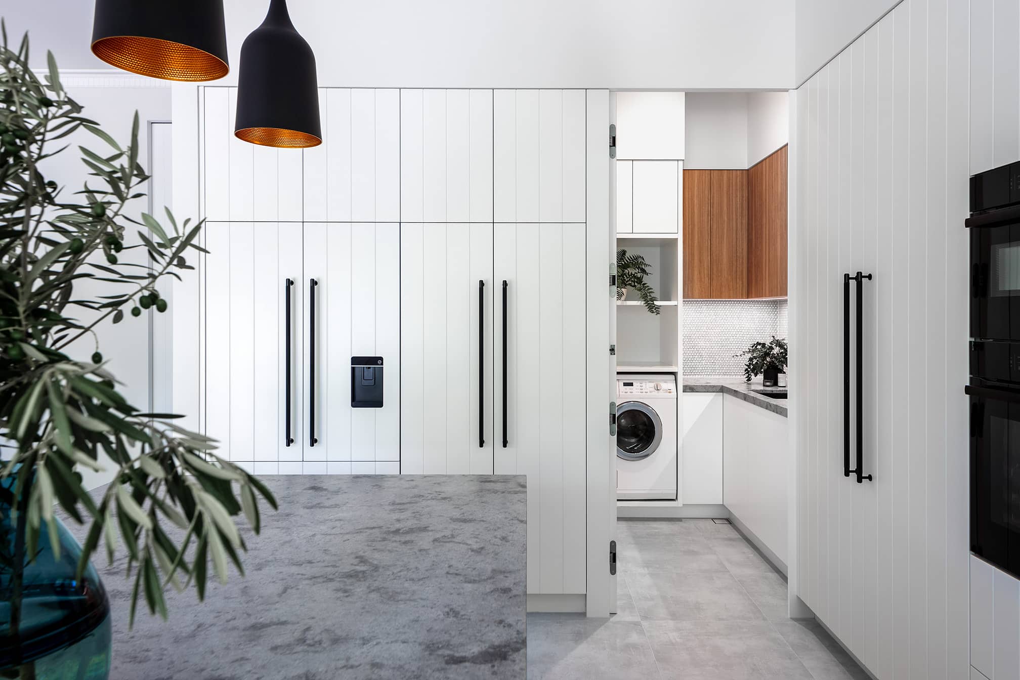 A photo of a modern kitchen with natural lighting.