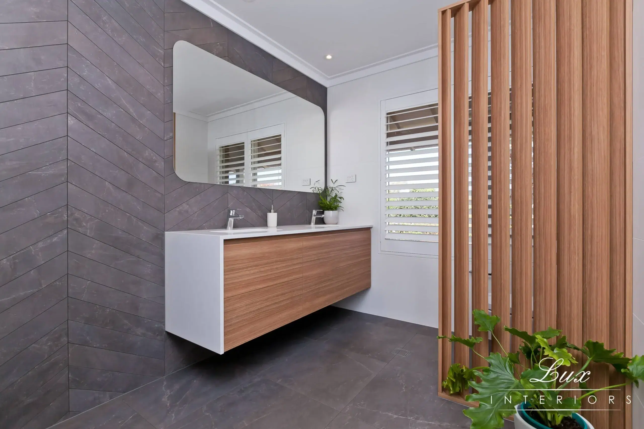 A photo of a bathroom with a sink.