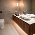 A photo of a bathroom, with a toilet and sink.