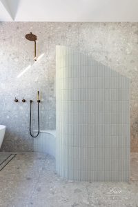 A photo of a bathroom, with a shower.