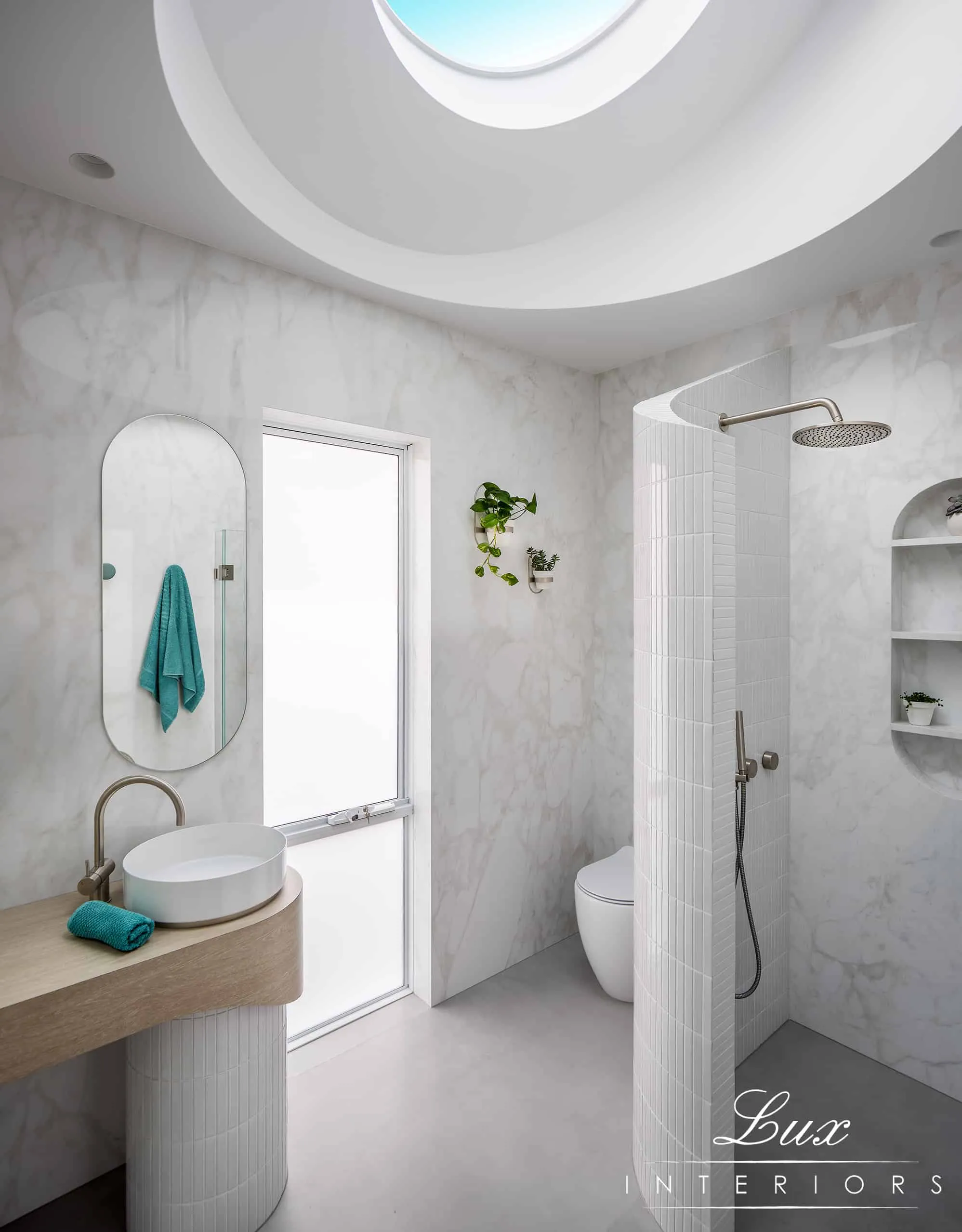 A photo of a curved skylight above a bathroom.